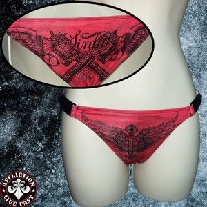 Sinful by affliction metal rhinestone weapon gun cross wings